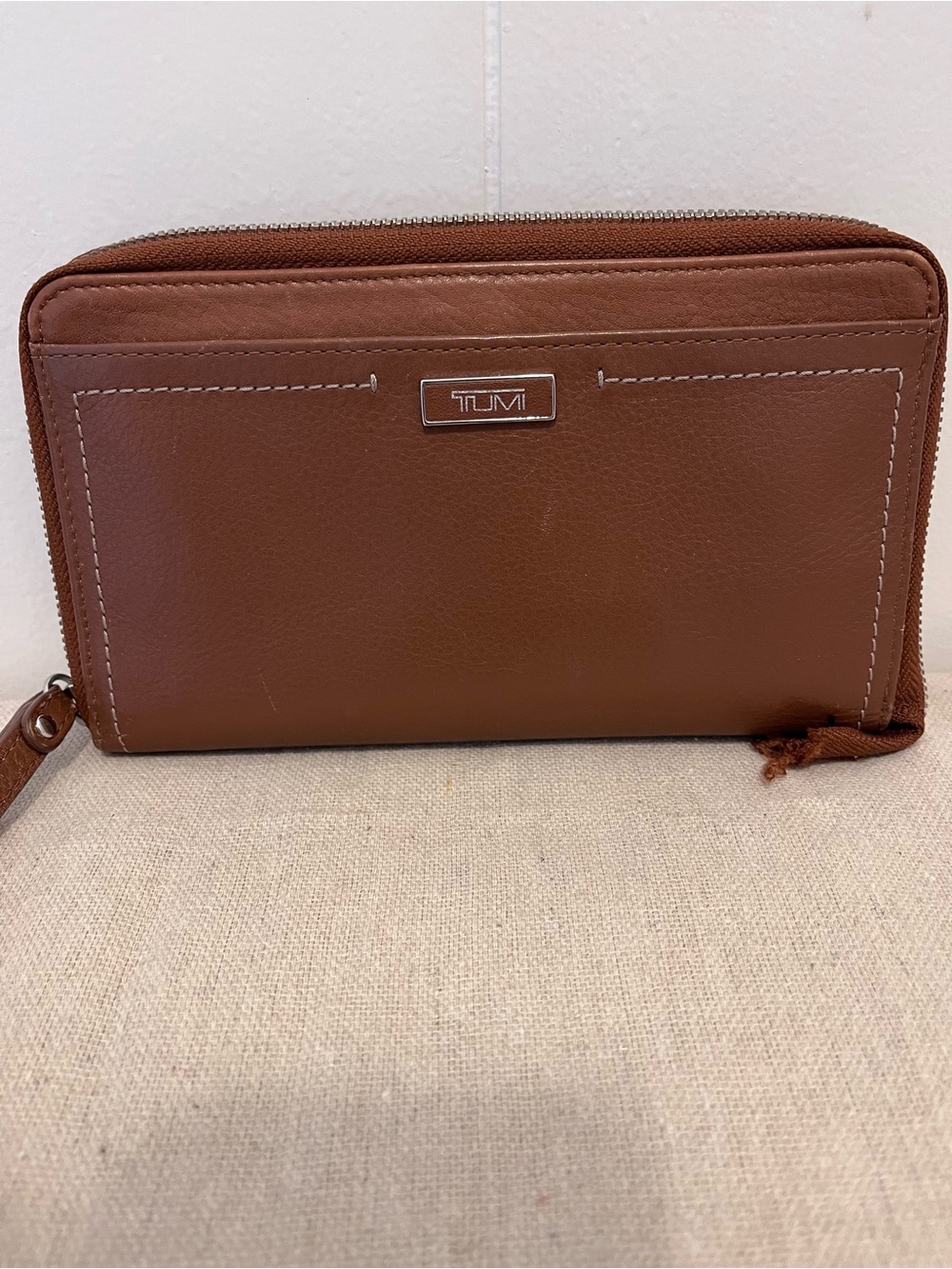 Tumi Zip Around leather wallet